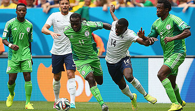 Victor Moses challenges Blaise Matuidi to the ball. Nigeria lost 2-0 to France last night in the second round of the Brazil World Cup.