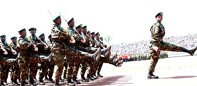 An RDF female Lieutenant leads a section of the Armed forces parade at the Amahoro stadium during the 20th Liberation Anniversary celebrations yesterday. John Mbanda. 