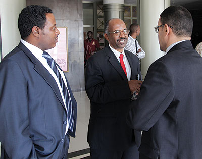 Dafalla (centre) chats with other participants at the summit. Dafalla has called for more investment in the  regional aviation sector to improve safety  and standards. The New Times / John Mbanda