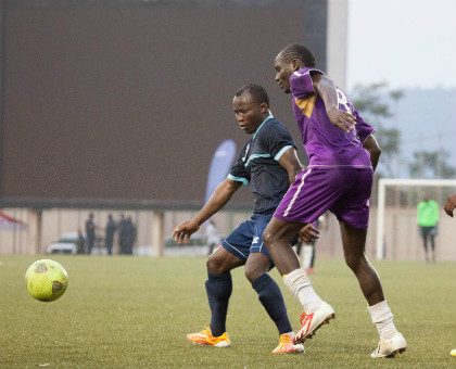 Vital'O's Hamadi Ndikumana, right, battles with Police FC's Mwemere Ngirinshuti during the just concluded Kagame Cup. (Timothy Kisambira)