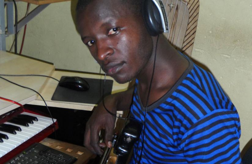 Producer Jimmy Pro at work in his studio. (Moses Opobo)