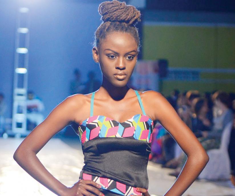 A model showcases designs by Rwandan fashion designers.