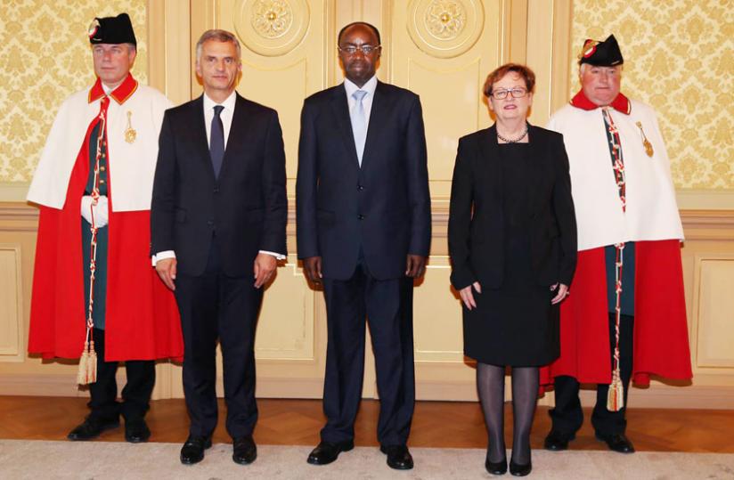 Amb. Ngarambe (centre) after presenting his credentials to Swiss Confederation president Burkhalter (2nd left) at the Federal Palace in Bern. (Courtesy)