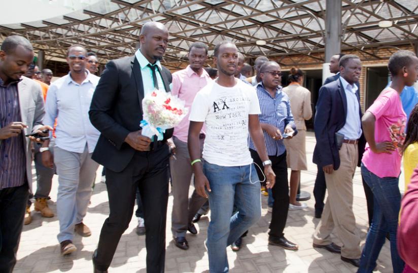 Frankie oozed elegance in a black suit and a long-sleeve green shirt as he arrived from Johannesburg.