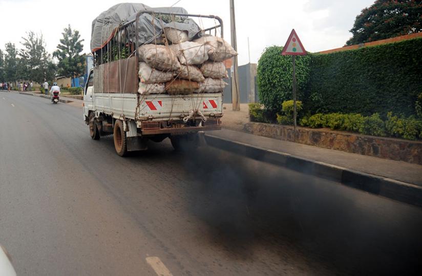 A vehicle on Kanombe- Remera road emits black smoke in 2012. (John Mbanda)