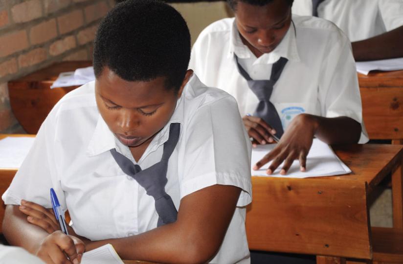 Students doing exams. You can use Insurance as an avenue of saving money for your childrenu00e2u20acu2122s education. (File)