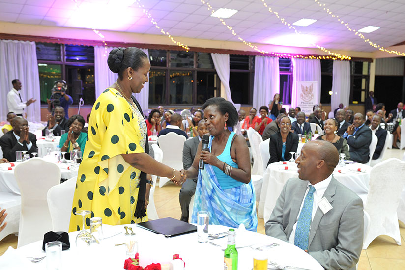 Beneficiary of Centre Ireme (CVX) Jeannette Nirere greets the First Lady, Jeannette Kagame. (Courtesy)