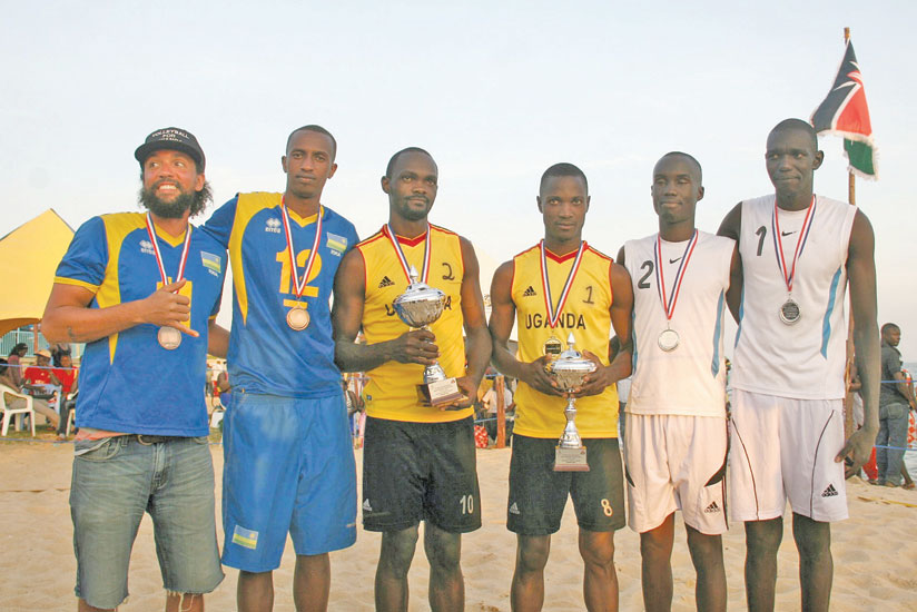 Rwanda's Ntagengwa and Ruhumuliza, left, pose for a group photo with the Uganda's gold and silver medallists. (Courtesy photo)