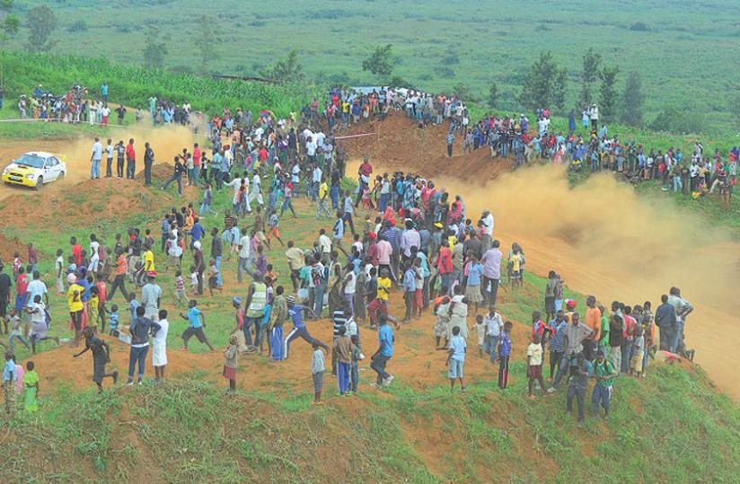 Fans watch the Rallye de Mille Collines Super stage at Gahanga. The race has been renamed after fallen navigator Christophe Dusquene who died in an accident on saturday on day two.  (Courtesy)