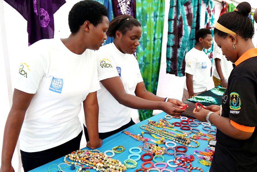 Some of the graduates showcase ornaments during the graduation ceremony yesterday. (John Mbanda)