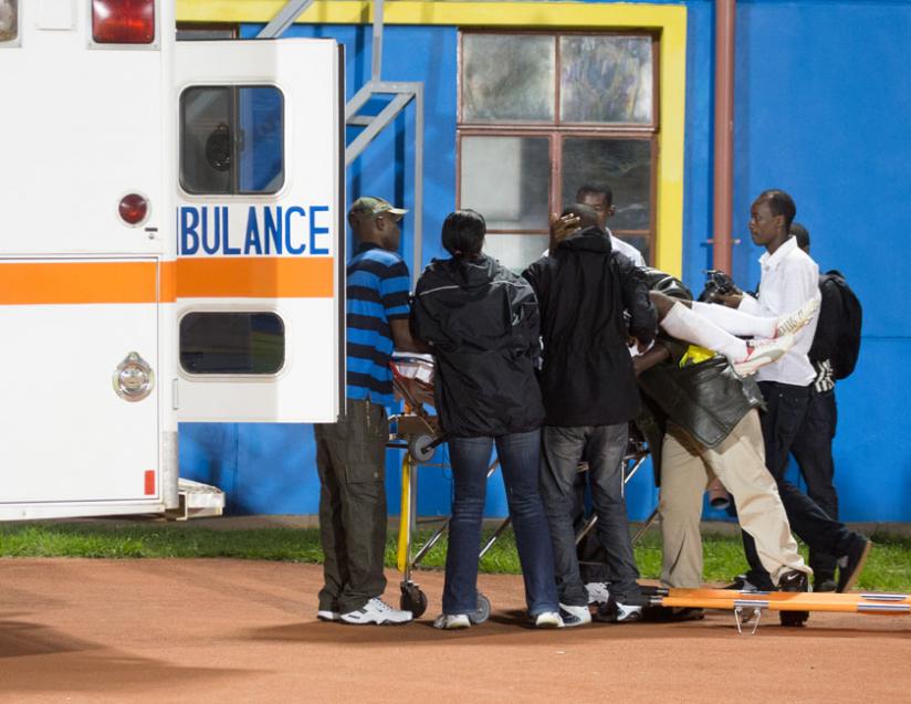 An ambulance takes APR defender Albert Ngabo who got a knock to the head during a league tie against Rayon Sports. (Timothy Kisambira)