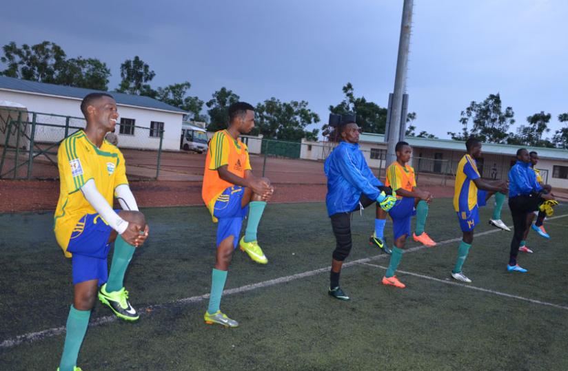 Amavubi players stretch during training before their friendly against Burundi. The players start training next week ahead of their tie against Tanzania. Sam Ngendahimana.