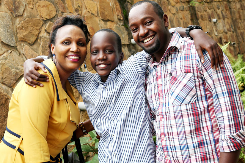 Bayigamba with his mother and uncle yesterday. (John Mbanda)