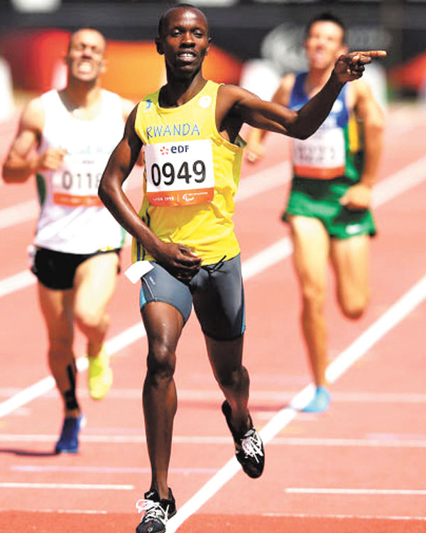 Hermas Cliff Muvunyi celebrates after stricking gold at the 6th IPC World championships in Lyon, France in 2013