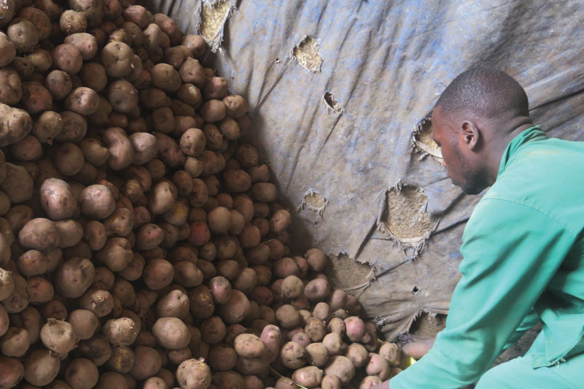 Karake at his store in Nyabugogo. Prices of most foodstuffs are unchanged despite reduction in fuel proces. (Theogene Nsengimana)