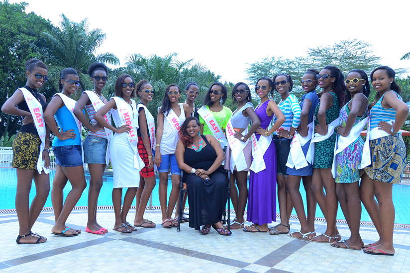 Miss Rwanda 2015 contestants pose for a picture with team manager, Aline Gahongayire.