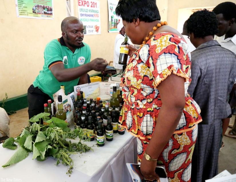 A native healer displays herbs at a youth entrepreneurship expo in Kigali last year. (J. Mbanda)