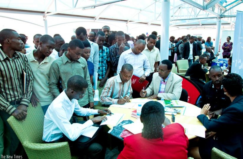 Graduates seek job opportunities with various employers during Job Day  in 2013. (File)