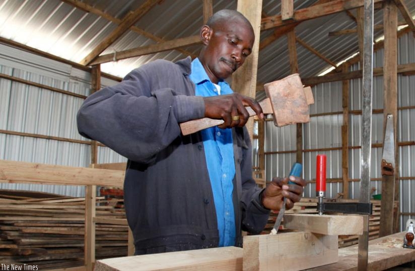 A carpenter at work in Gikondo. It is crucial for all businesses, small or big, to compile financial statements regularly. (File)