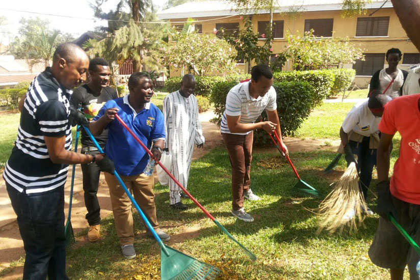 Rwandan students in Uganda participate in the monthly community work, Umuganda, at Nsambya Hospital, Uganda. (Courtesy)