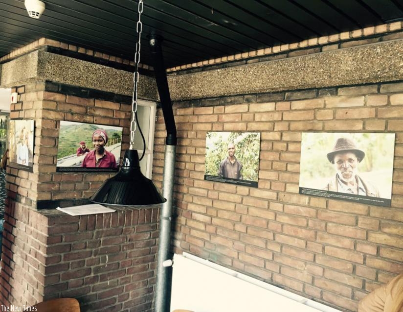 Photos on exhibition in the cafe include Rwandans who work in a coffee plantation in Rwanda. (Courtesy)