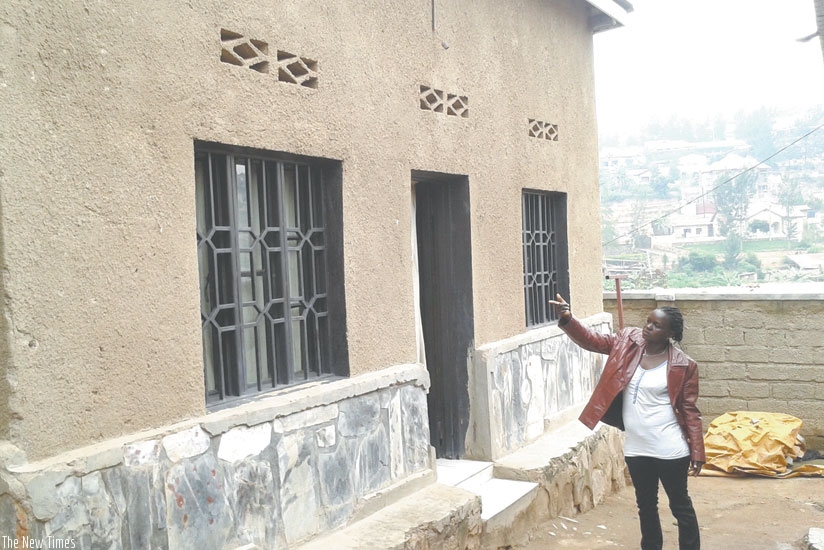 Mukahirwa points at one of her houses which she rents out in Gishushu, Kigali. (File)