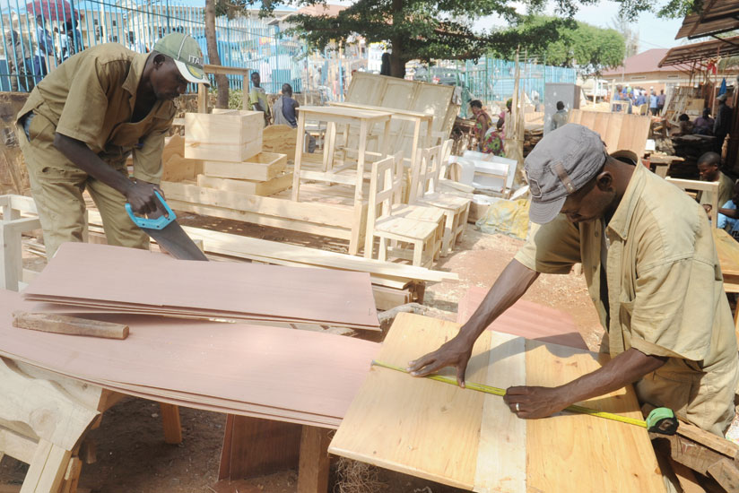 City carpenters at work. Manufacturers in EAC want governments to support skills development. 