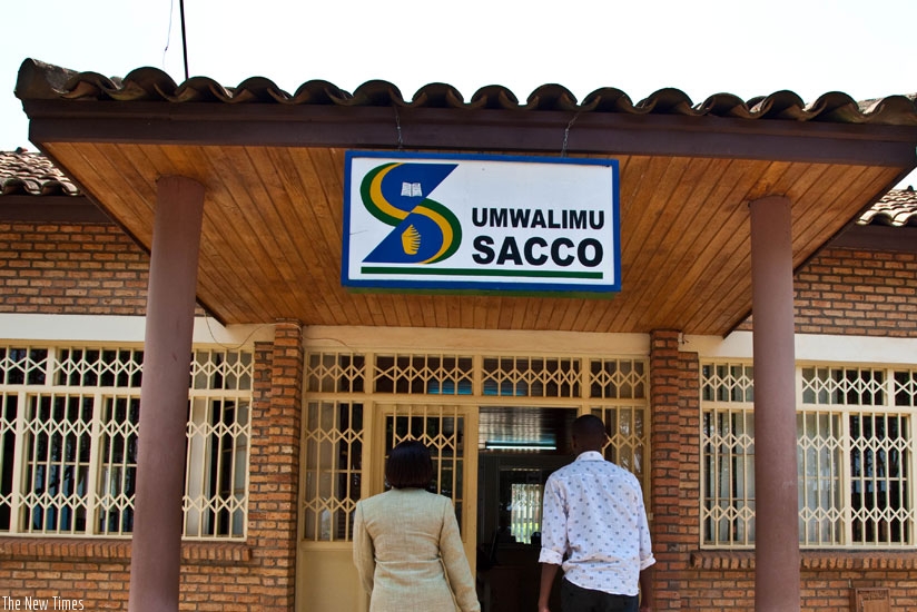 Teachers enter Umwalimu Sacco Remera branch. Bad loans are affecting the growth of micro-finance industry. (File)