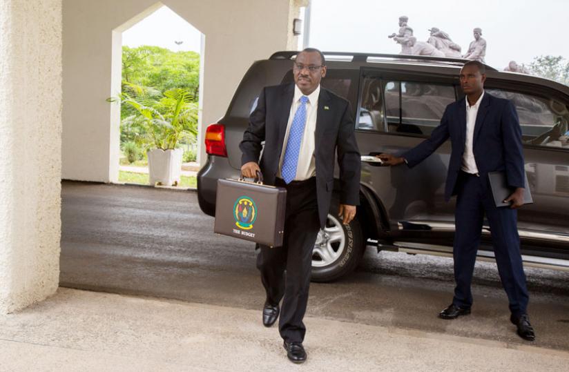 Finance minister Claver Gatete arrives at Parliament to read the 2015-16 National Budget. (Timothy Kisambira)