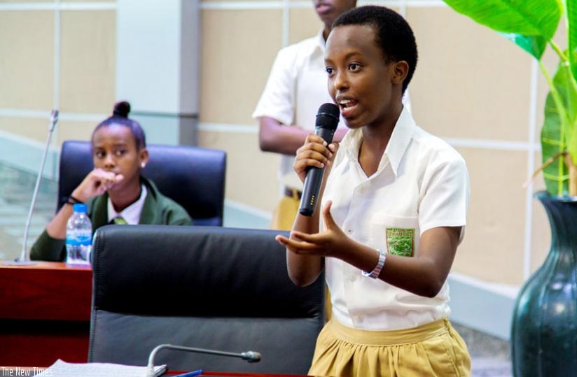 Lorence Umuhoza Tumukunde, a student from , Lycee de Kigali debates, while opposing the motion at the City Hall yesterday. (Doreen. Umutesi)