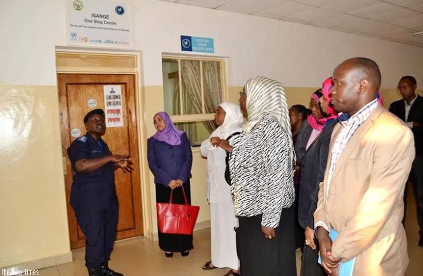 A Police officer shows Zanzibari legislators around Isange One Stop Centre in the past. (Net)