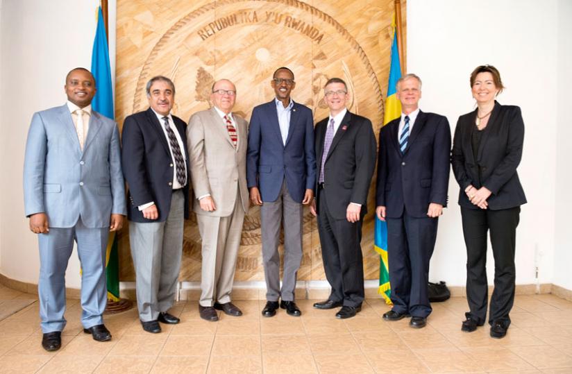 President Kagame (C) in a group photo with a delegation of staff from Carnegie Mellon University (CMU), a top private research varsity in the US at Village Urugwiro, in Kacyiru, Kigali yesterday. The delegation was led by Prof. Jared Cohon (on the President's left), the president emeritus of CMU. (Village Urugwiro)