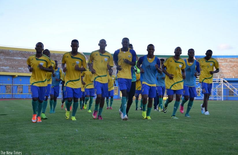 Amavubi players warm up during a training session at Amahoro stadium. The team will travel to Scotland for a two-week training camp from August 2-19. (S. Ngendahimana)