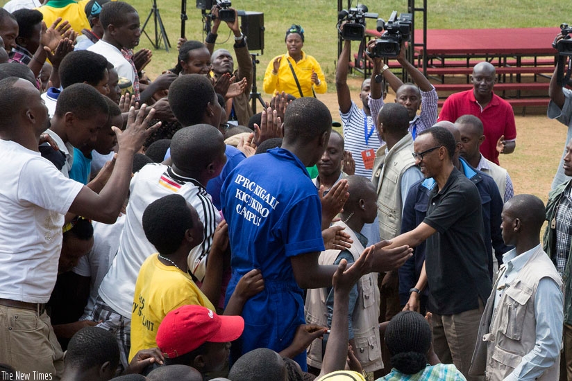 President Kagame takes time to greet and talk to Kicukiro residents after Umuganda yesterday. The President commended them for their involvement in developing their neighborhood and country. (Village Urugwiro)