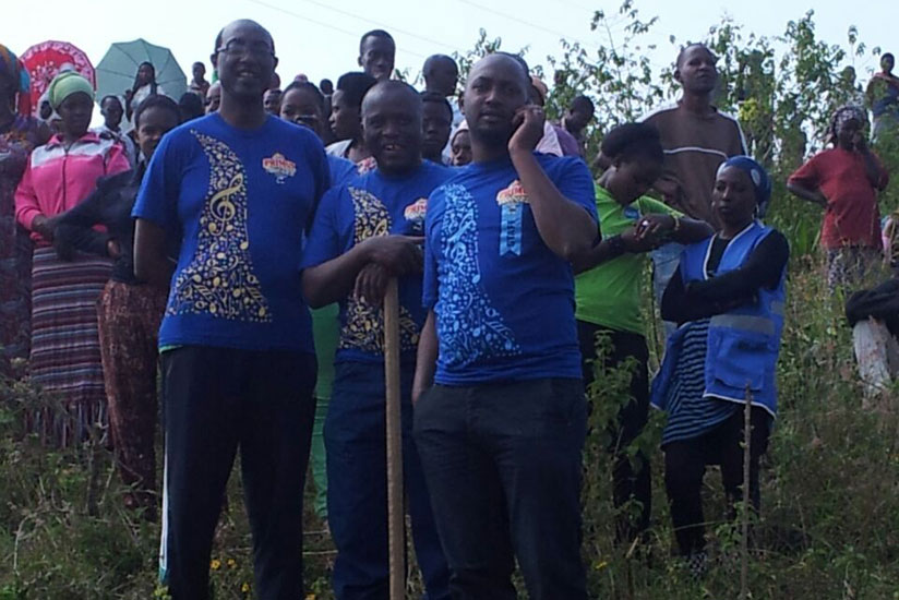 L-R,Bralirwa's Desire Maniraguha, Emamanuel Muyakindi and Gilbert Mutimura after the muganda with Rwamagana residents.