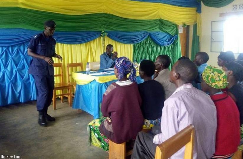 (AIP) Minani talks to couples in Ngororero before their reunion on Tuesday. (Courtesy)