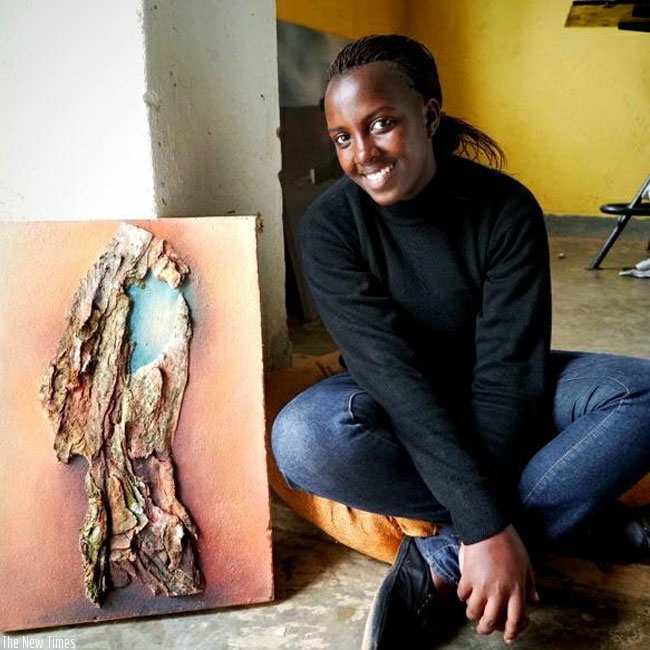 Hortance Kamikazi poses with one of her art pieces. (Courtesy photos)