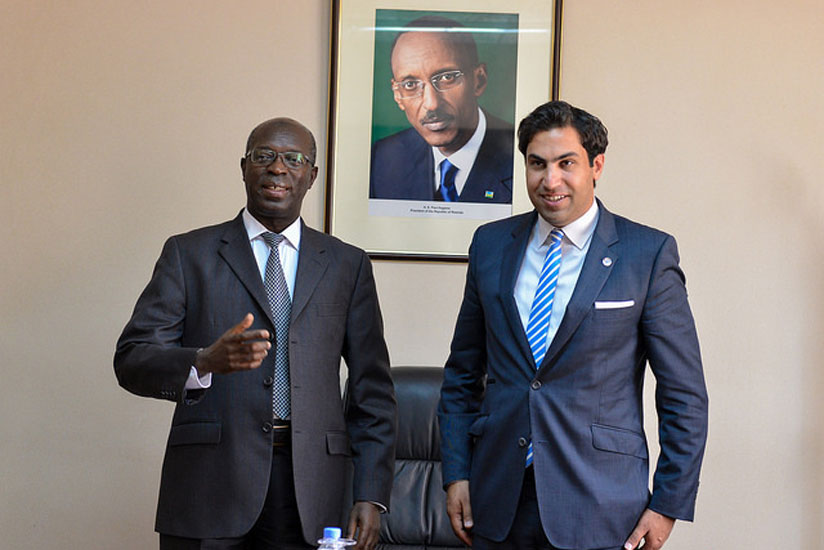 Premier Murekezi (L) and the UN Special Envoy on Youth, Ahmad Alhendawi pose for a photo.