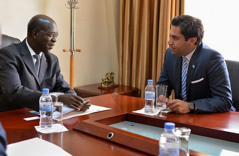 Prime Minister Anastase Murekezi (L) chatting with the UN Secretary-General's Envoy Ahmad Alhendawi, today. (Jean Mugabo)