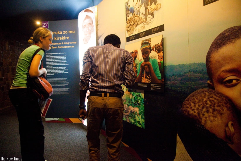 People read about the 1994 genocide against the Tutsi at Kigali memorial. (File)