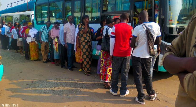 Passengers queue at masaka waiting for Kigali Bus service. (Timothy Kisambira)