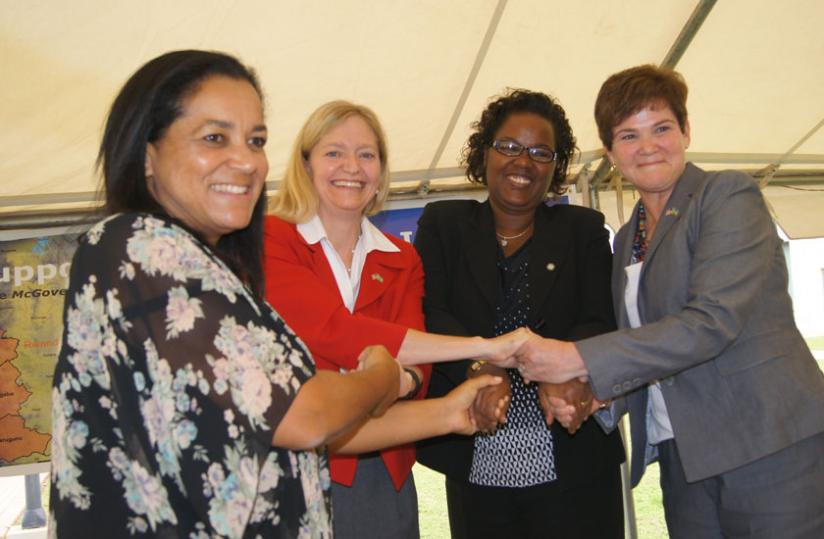 L-R: Valerie Guarnieri, WFP Regional Director for East and Central Africa; US Ambassador to Rwanda Erica Barks-Ruggles; Agriculture Minister Geraldine Mukeshimana; and Krysta Harden, the USDA Deputy Secretary, shake hands after signing a $25 million grant in Kigali on Monday. (Jean Mugabo)