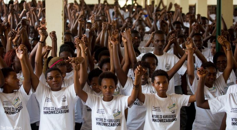 Youth join hands as a sign of solidarity during a civic education training at Gisozi last year. (File)