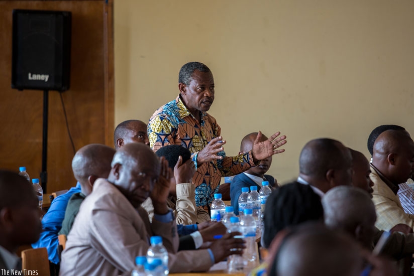 Bodouin Kayumba asks a question during the meeting. (Timothy Kisambira)