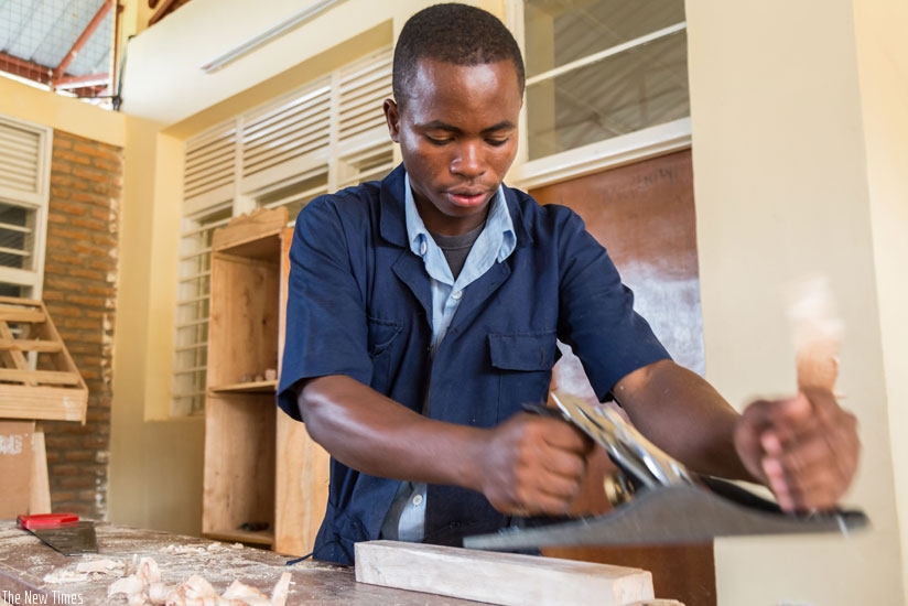 A student of VTC Muganza in Rusizi District makes a chair. Government is promoting TVET as an ideal education path. (File)