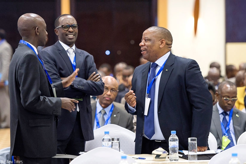 Local Government minister Francis Kaboneka (L) chats with Governors Alphonse Munyantwari of Southern Province (C) and Aime Bosenibamwe of Northern Province  at the report launch yesterday. (Courtesy)