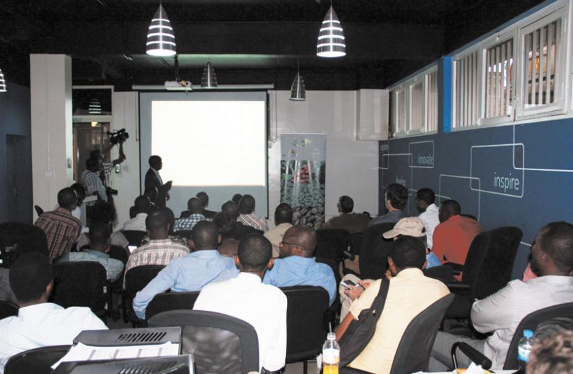 Farmers and buyers attend the online coffee auction at Cafe Neo in Kacyiru. The auction attracted buyers from the  US, S.Africa and the UK.(P. Tumwebaze)