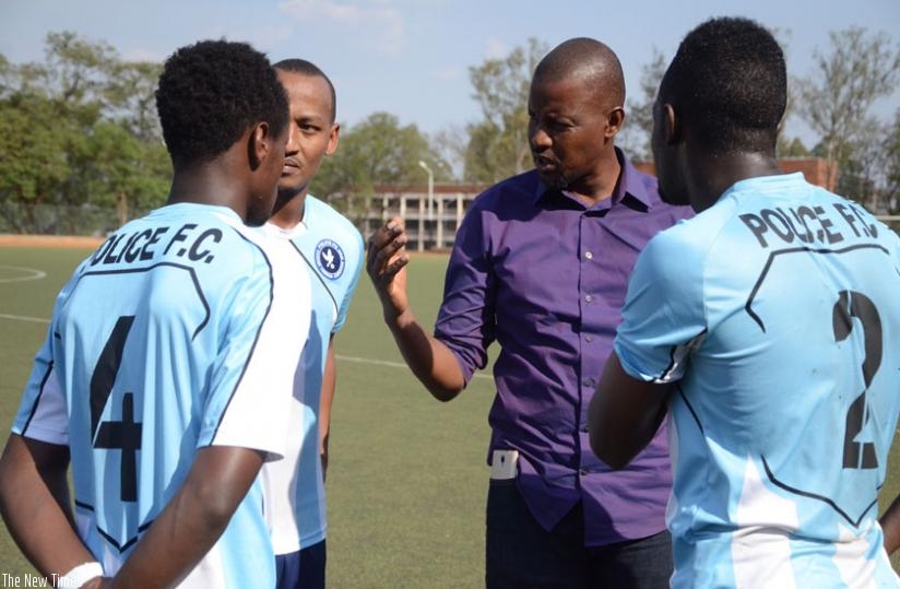 Police head coach Andre Cassa Mbungo talks to his players at half time on Tuesday when his side thrashed Bugesera 3-0. (Sam Ngendahimana)