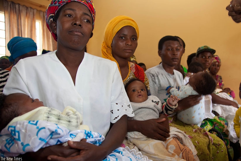 Mothers await treatment of their babies at a health facility. Mutuelle de Sante facilitates easy access to medical services from health facilities. (File)