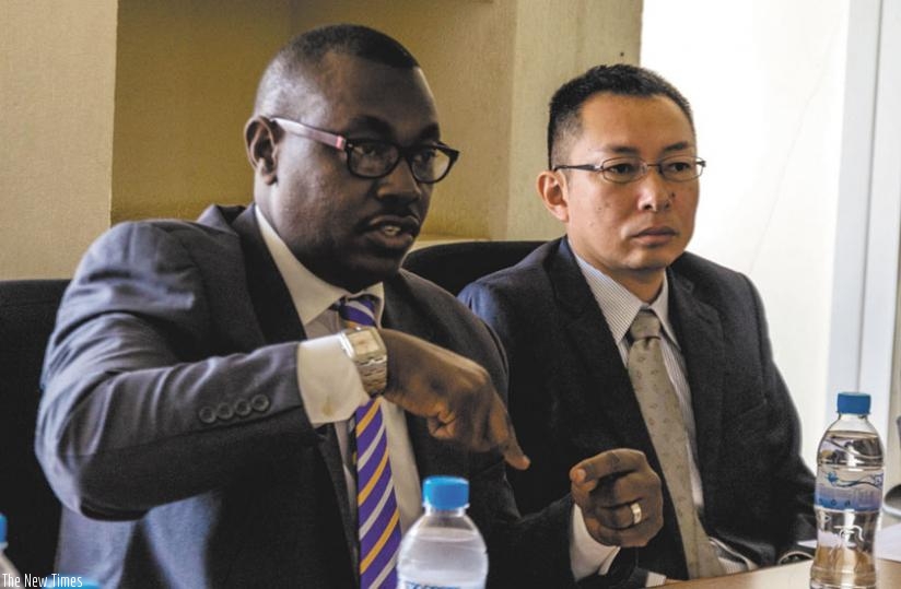 Ford speaks during the conference (L) after local ICT firms representatives returned from a trip to Japan. Looking on is JICA's Moriyative. (Teddy Kamanzi)